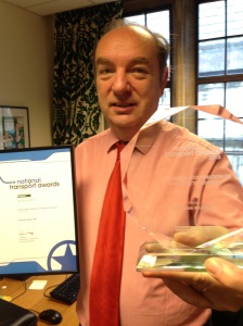 Norman with his awards for 'Outstanding Contribution to Transport'